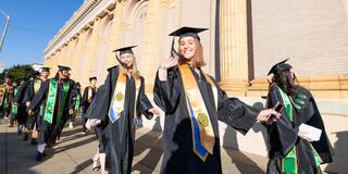 Graduates in front of St. Ignatius