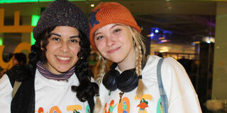 two students wearing vote shirts