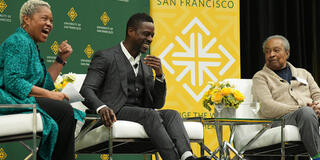 Stephanie D. Sears, Sterling K. Brown and Dr. Clarence B. Jones speak onstage.