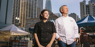 Two people in chef coats in downtown SF.