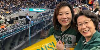 two people cheering on USF basketball