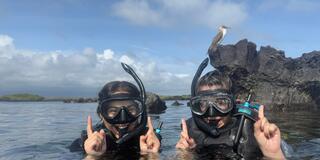 Two students snorkeling in the Galapagos