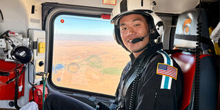 Paul Uong in a helicopter