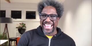 W. Kamau Bell laughs during USF webinar