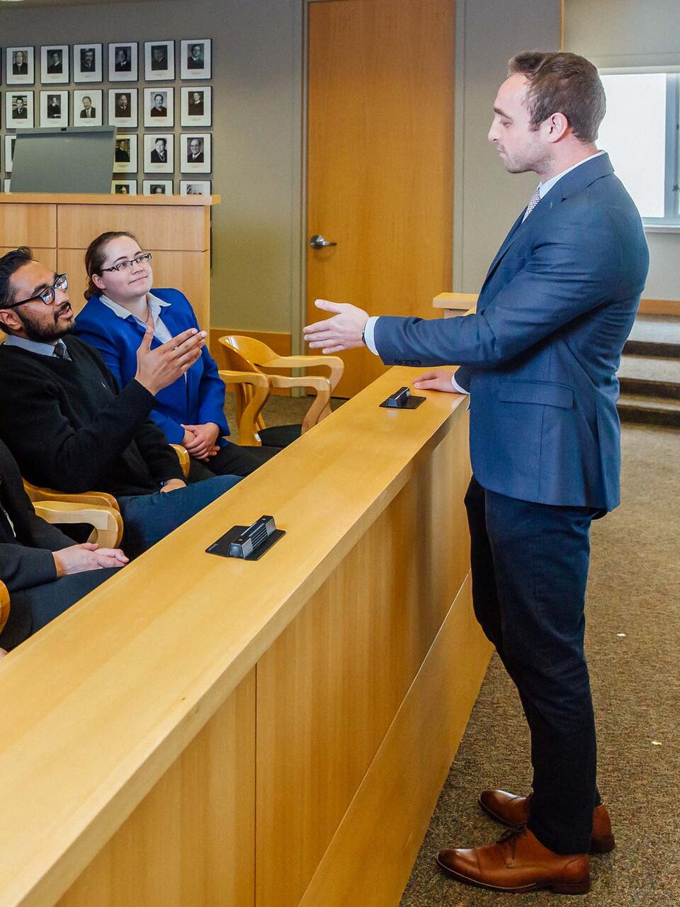 Student presents to a jury in moot court.