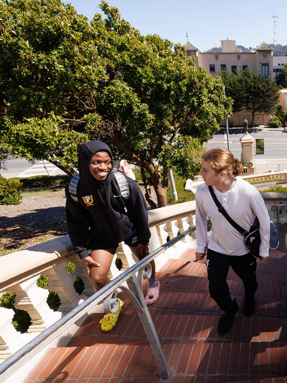 students walking up lone mountain steps