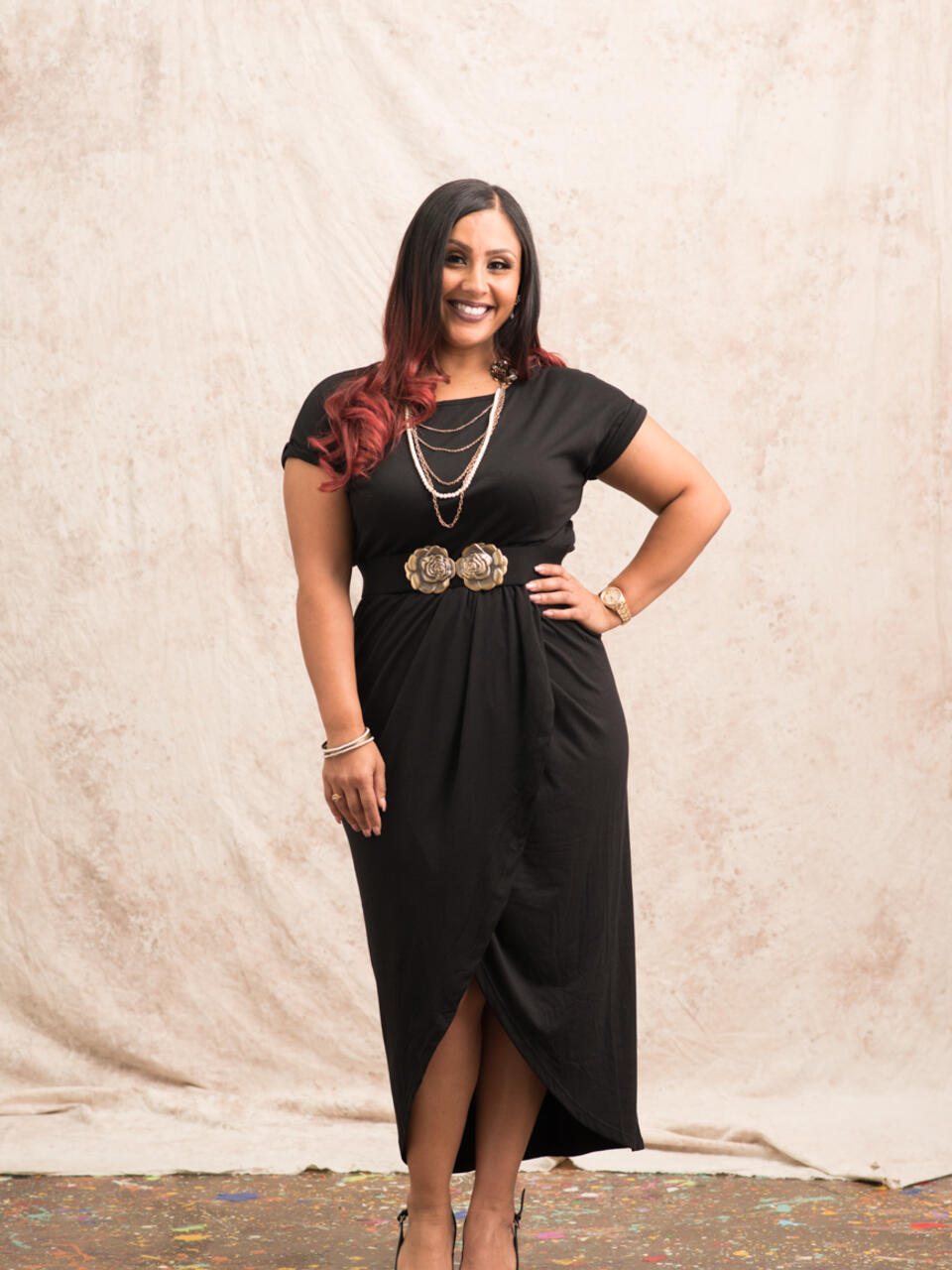 Faculty member stands facing camera